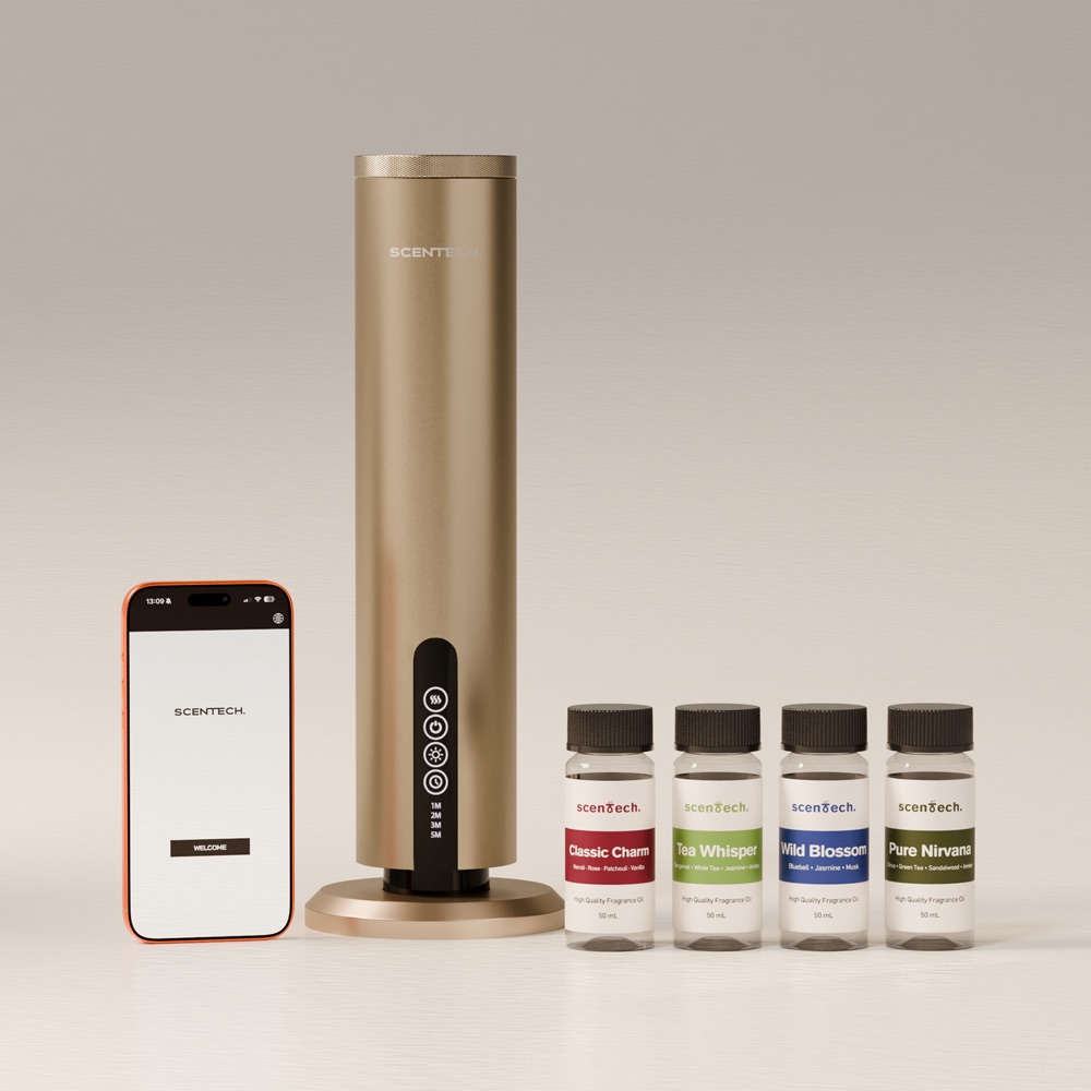 The Scentech Smart Aroma Diffuser Pro in aluminium, with the app and two pods beside it